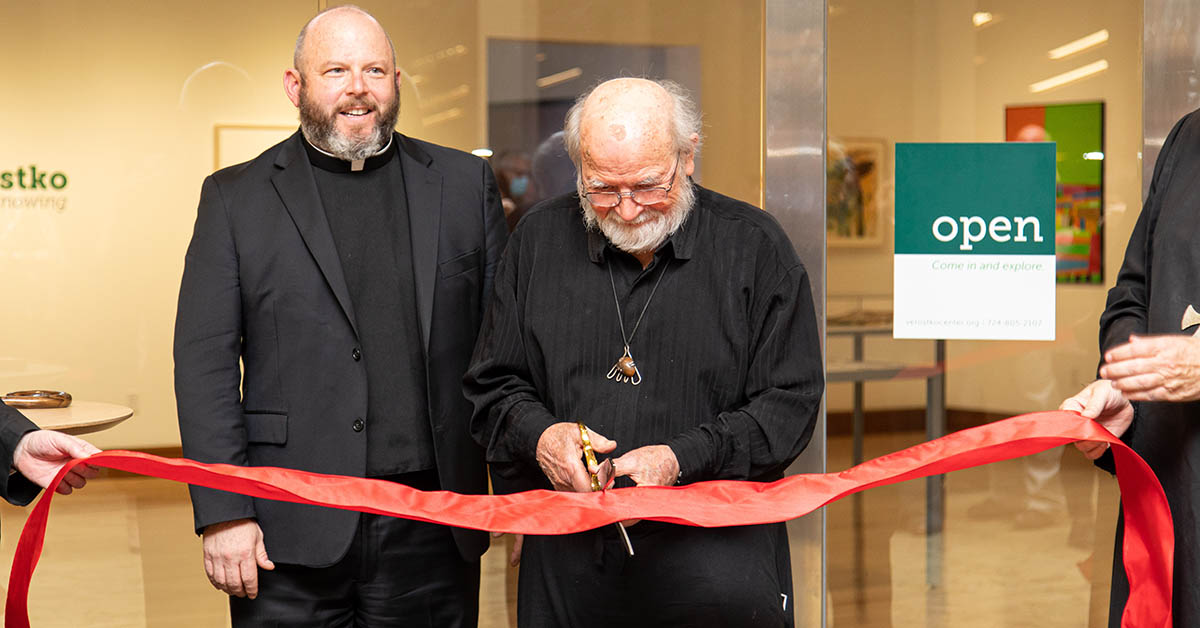 roman verostko cuts the ribbon at the verostko center for the arts dedication at saint vincent college